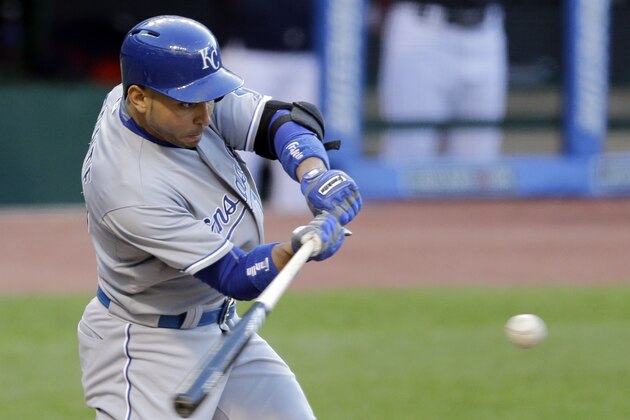 Kansas City Royals’ Omar Infante hits an RBI-single off Cleveland Indians starting pitcher Trevor Bauer in the fourth inning of a baseball game, Tuesday, April 28, 2015, in Cleveland. Kendrys Morales scored on the play. (AP Photo/Tony Dejak)
