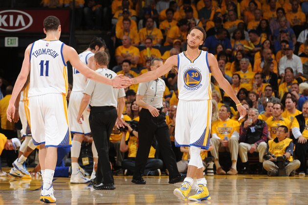 OAKLAND, CA - MAY 13: Klay Thompson #11 and Stephen Curry #30 of the Golden State Warriors during the game against the Memphis Grizzlies in Game Five of the Western Conference Semifinals of the 2015 NBA Playoffs on May 13, 2015 at Oracle Arena in Oakland, California. NOTE TO USER: User expressly acknowledges and agrees that, by downloading and or using this photograph, user is consenting to the terms and conditions of Getty Images License Agreement. Mandatory Copyright Notice: Copyright 2015 NBAE (Photo by Noah Graham/NBAE via Getty Images)