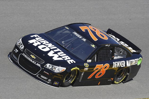 Martin Truex Jr. drives on the track during practice for the Daytona 500 NASCAR Sprint Cup Series auto race at Daytona International Speedway, Saturday, Feb. 14, 2015, in Daytona Beach, Fla.  (AP Photo/David Graham)