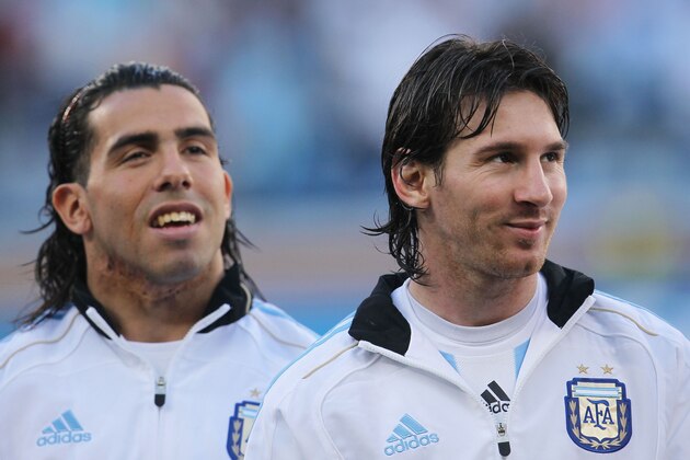 CAPE TOWN, SOUTH AFRICA - JULY 03:  Carlos Tevez and Lionel Messi of Argentina ahead of the 2010 FIFA World Cup South Africa Quarter Final match between Argentina and Germany at Green Point Stadium on July 3, 2010 in Cape Town, South Africa.  (Photo by Chris McGrath/Getty Images)