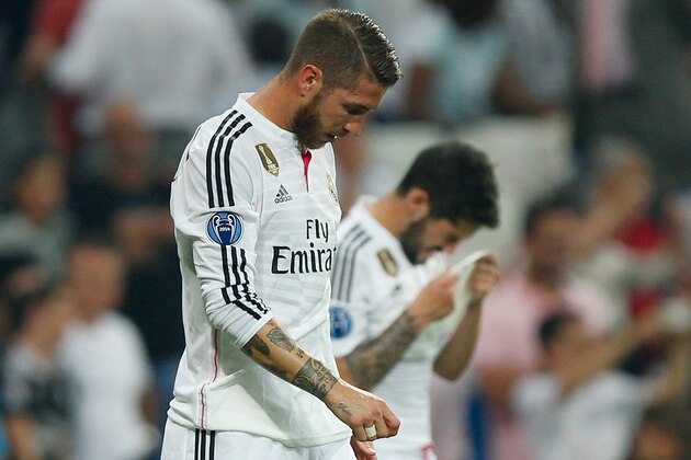 MADRID, SPAIN - MAY 13:  A dejected Sergio Ramos of Real Madrid reacts following his team's exit from the competition during the UEFA Champions League Semi Final, second leg match between Real Madrid and Juventus at Estadio Santiago Bernabeu on May 13, 2015 in Madrid, Spain.  (Photo by Gonzalo Arroyo Moreno/Getty Images)