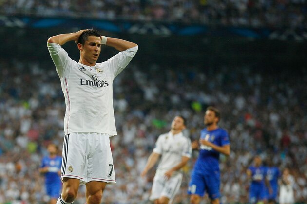 MADRID, SPAIN - MAY 13:  Cristiano Ronaldo of Real Madrid reacts after a missed chance on goal during the UEFA Champions League Semi Final, second leg match between Real Madrid and Juventus at Estadio Santiago Bernabeu on May 13, 2015 in Madrid, Spain.  (Photo by Gonzalo Arroyo Moreno/Getty Images)