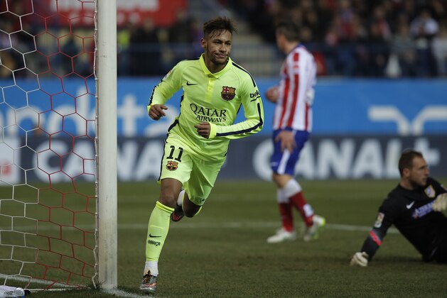 Barcelona's Neymar, left, celebrates his second goal during a second leg quarterfinal Copa del Rey soccer match between Atletico de Madrid and FC Barcelona at the Vicente Calderon stadium in Madrid, Spain, Wednesday, Jan. 28, 2015. (AP Photo/Andres Kudacki)