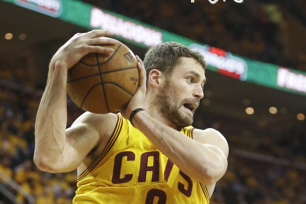Cleveland Cavaliers' Kevin Love grabs a rebound against the Oklahoma City Thunder in the third quarter of an NBA basketball game Sunday, Jan. 25, 2015, in Cleveland. The Cavaliers won 108-98 to extend their winning streak to six games. (AP Photo/Mark Duncan)