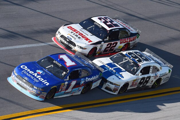 May 2, 2015; Talladega, AL, USA; NASCAR Xfinity Series driver Elliott Sadler (1) leads Aric Almirola (98) and Joey Logano (22) during the Winn Dixie 300 at Talladega Superspeedway. Mandatory Credit: Mike DiNovo-USA TODAY Sports