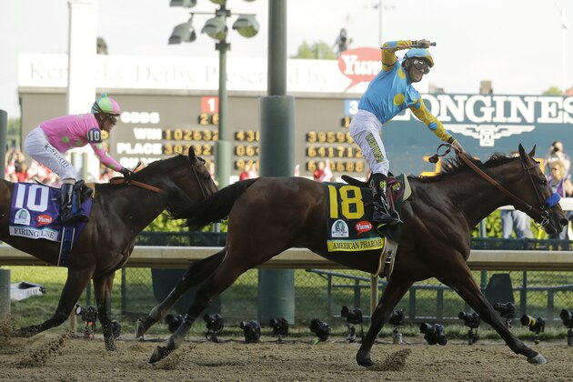 Victor Espinoza rides American Pharoah to victory in the 141st running of the Kentucky Derby horse race at Churchill Downs Saturday, May 2, 2015, in Louisville, Ky. (AP Photo/Morry Gash)