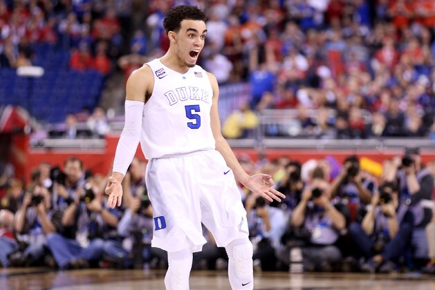 INDIANAPOLIS, IN - APRIL 06:  Tyus Jones #5 of the Duke Blue Devils reacts after a three point basket late in the second half against the Wisconsin Badgers during the NCAA Men's Final Four National Championship at Lucas Oil Stadium on April 6, 2015 in Indianapolis, Indiana.  (Photo by Andy Lyons/Getty Images)