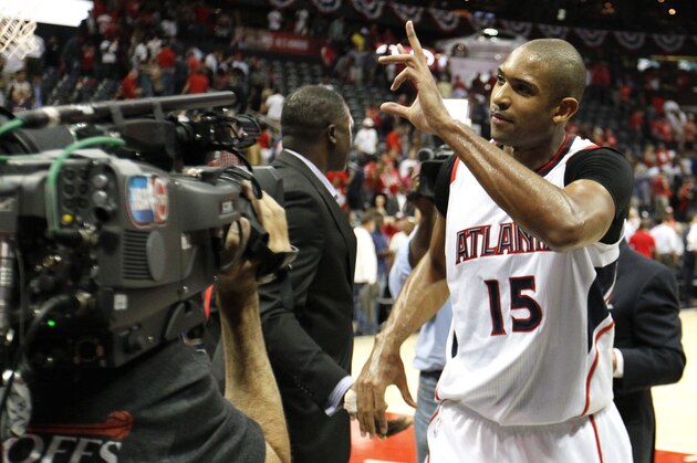 ATLANTA, GA - MAY 13:  Al Horford #15 of the Atlanta Hawks celebrates the win against the Washington Wizards after Game Five of the Eastern Conference Semifinals of the 2015 NBA Playoffs at Philips Arena on May 13, 2015 in Atlanta, Georgia. The Hawks beat the Wizards 82 - 81.  NOTE TO USER: User expressly acknowledges and agrees that, by downloading and/or using this photograph, user is consenting to the terms and conditions of the Getty Images License Agreement.  (Photo by Kevin C. Cox/Getty Images)