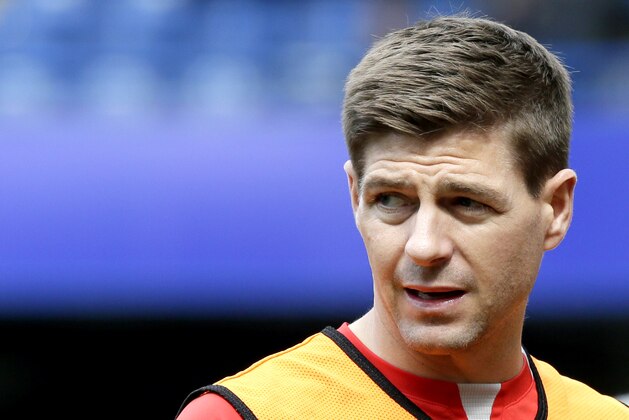 Liverpool’s Steven Gerrard warms up ahead of the English Premier League soccer match between Chelsea and Liverpool at Stamford Bridge, London, Sunday, May 10, 2015. (AP Photo/Tim Ireland)