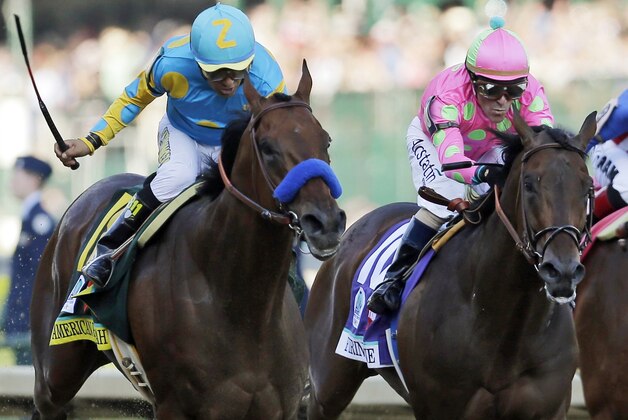 FILE - In this photo taken Saturday, May 2, 2015, jockey Victor Espinoza, left, rides American Pharoah to victory ahead of jockey Gary Stevens and Firing Line, during the 141st running of the Kentucky Derby horse race at Churchill Downs in Louisville, Ky. Stevens nearly won another Derby two weeks ago aboard Firing Line. The 52-year-old rider knows his way around Pimlico Race Course, too, and says his once-aching knees are feeling great and he’s ready to go in the Preakness. (AP Photo/Jeff Roberson, File)