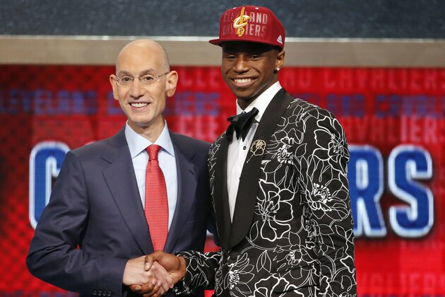 FILE - In this June 25, 2014, file photo, NBA Commissioner Adam Silver, left, congratulates Andrew Wiggins of Kansas who was selected by the Cleveland Cavaliers as the No. 1 pick in the 2014 NBA basketball draft in New York. The Minnesota Timberwolves, Cavaliers and Philadelphia 76ers completed a blockbuster trade sending Kevin Love to team up with LeBron James in Cleveland for 2014 No. 1 draft pick Andrew Wiggins on Saturday, Aug. 23, 2014, a person familiar with the trade said. The Timberwolves are getting Wiggins and former top pick Anthony Bennett from Cleveland and veteran forward Thaddeus Young from Philadelphia. The 76ers get a 2015 first-round draft choice from Cleveland, and guard Alexey Shved and forward Luc Mbah a Moute from Minnesota. (AP Photo/Jason DeCrow, File)