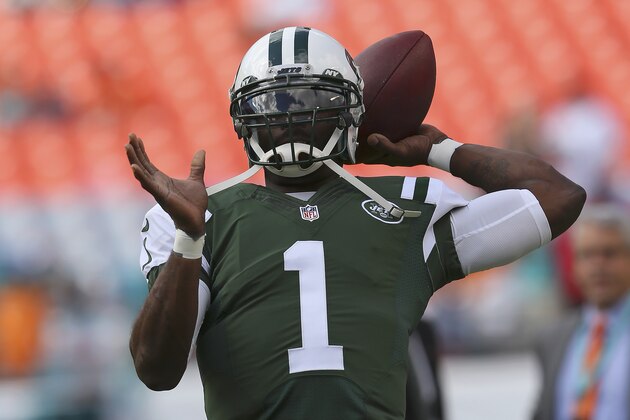 MIAMI GARDENS, FL - DECEMBER 28:  Quarterback Michael Vick #1 of the New York Jets throws during pregame workouts before the Jets met the Miami Dolphins at Sun Life Stadium on December 28, 2014 in Miami Gardens, Florida.  (Photo by Mike Ehrmann/Getty Images)