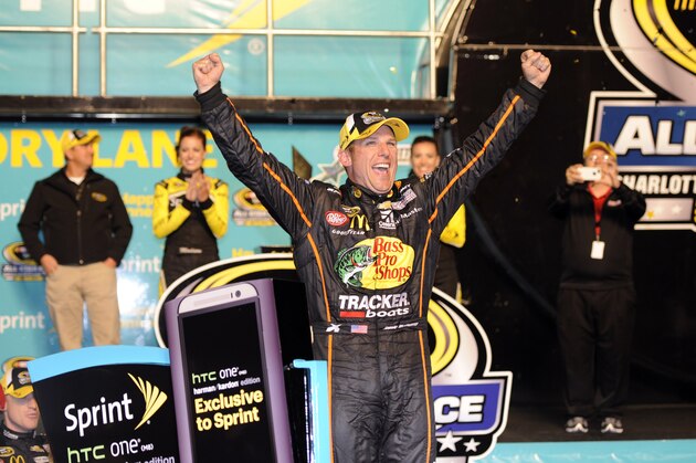 May 17, 2014; Concord, NC, USA; NASCAR Sprint Cup Series driver Jamie McMurray celebrates in victory lane after winning the Sprint All-Star race at Charlotte Motor Speedway. Mandatory Credit: Sam Sharpe-USA TODAY Sports