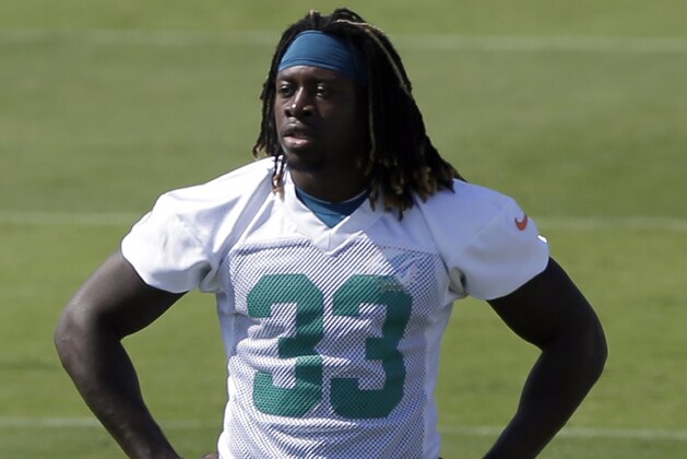 Miami Dolphins' Jay Ajayi takes a break during NFL football rookie minicamp, Saturday, May 9, 2015, in Davie, Fla. (AP Photo/Alan Diaz)