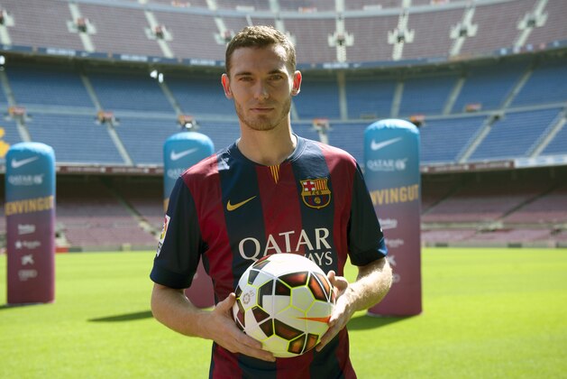FC Barcelona's new Belgian Thomas Vermaelen poses for the media during his official presentation at the Camp Nou stadium in Barcelona, Spain, Sunday, Aug. 10, 2014. Vermaelen agreed to sign a five-year contract. The 28-year-old Vermaelen will now be under the orders of Barcelona's new coach Luis Enrique. (AP Photo/Rodolfo Molina)