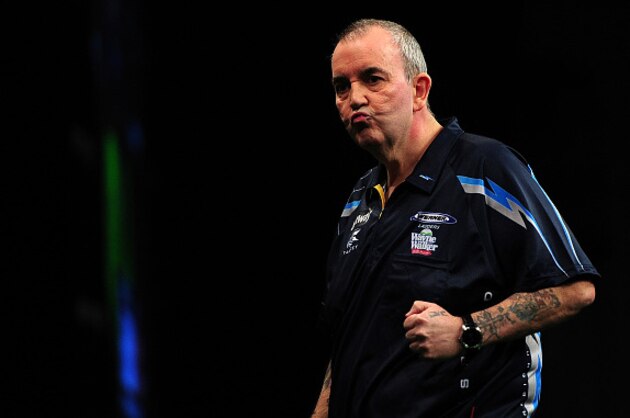 EXETER, ENGLAND - MARCH 05:  Phil Taylor of England celebrates winning a leg against James Wade of England during The Betway Premier League Darts at Westpoint Arena on March 5, 2015 in Exeter, England.  (Photo by Dan Mullan/Getty Images)