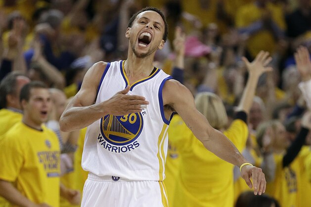 Golden State Warriors guard Stephen Curry (30) reacts after scoring during the first half of Game 5 in a second-round NBA playoff basketball series against the Memphis Grizzlies in Oakland, Calif., Wednesday, May 13, 2015. (AP Photo/Ben Margot)