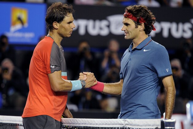 Rafael Nadal of Spain, left, is congratulated by Roger Federer of  Switzerland at the net after Nadal won their semifinal final at the Australian Open tennis championship in Melbourne, Australia, Friday, Jan. 24, 2014. (AP Photo/Andrew Brownbill)