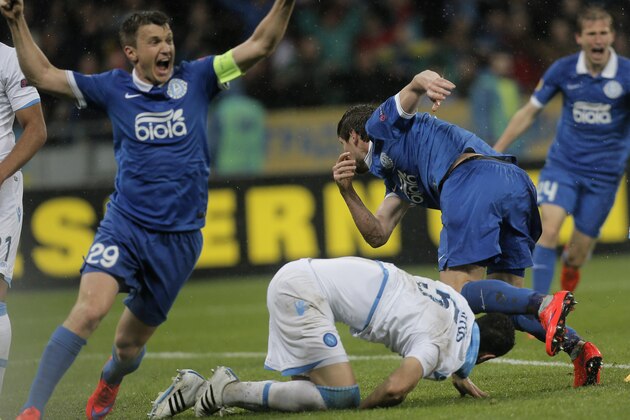 Dnipro's players  celebrates after scoring against  Napoli during the Europa League semifinal, second leg, soccer match between Napoli and Dnipro at Olimpiyskiy Stadium in Kiev, Ukraine, Thursday, May 14, 2015. (AP Photo/Efrem Lukatsky)