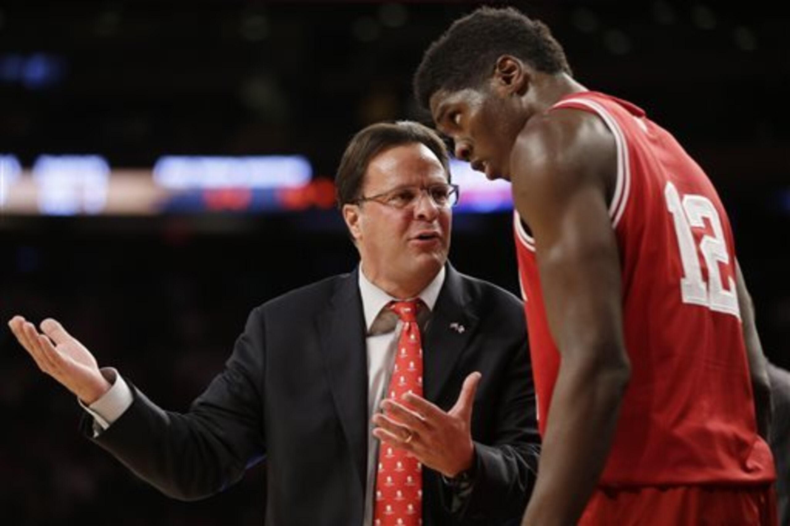 Indiana head coach Tom Crean, left, talks with Hanner Mosquera-Perea during the first half of an NCAA college basketball game against Washington Thursday, Nov. 21, 2013, in New York. (AP Photo/Seth Wenig)