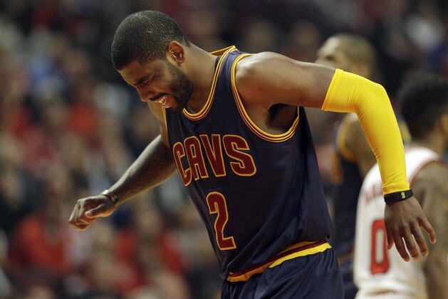 Cleveland Cavaliers guard Kyrie Irving (2) grimaces during the first half of Game 6 against the Chicago Bulls in a second-round NBA basketball playoff series in Chicago on Thursday, May 14, 2015. (AP Photo/Nam Y. Huh)