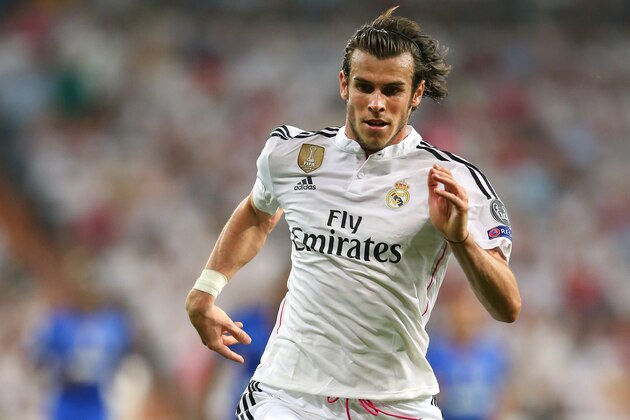 MADRID, SPAIN - MAY 13:  Gareth Bale of Real Madrid CF runs with the ball during the UEFA Champions League Semi Final second leg match between Real Madrid CF and Juventus at Estadio Santiago Bernabeu on May 13, 2015 in Madrid, Spain.  (Photo by Alex Livesey/Getty Images)