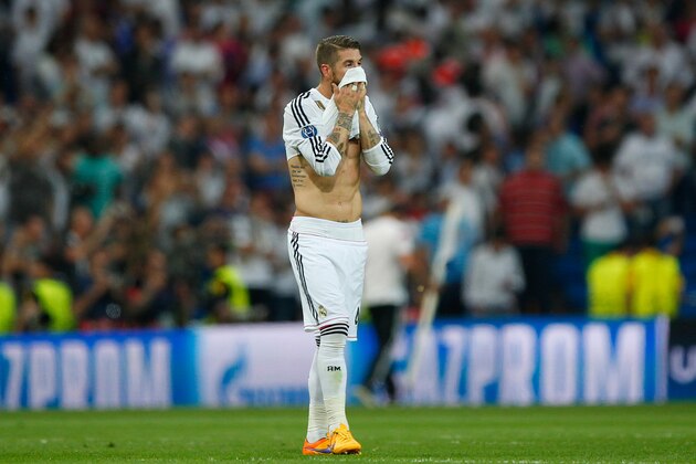 MADRID, SPAIN - MAY 13:  A dejected Sergio Ramos of Real Madrid reacts following his team's exit from the competition during the UEFA Champions League Semi Final, second leg match between Real Madrid and Juventus at Estadio Santiago Bernabeu on May 13, 2015 in Madrid, Spain.  (Photo by Gonzalo Arroyo Moreno/Getty Images)