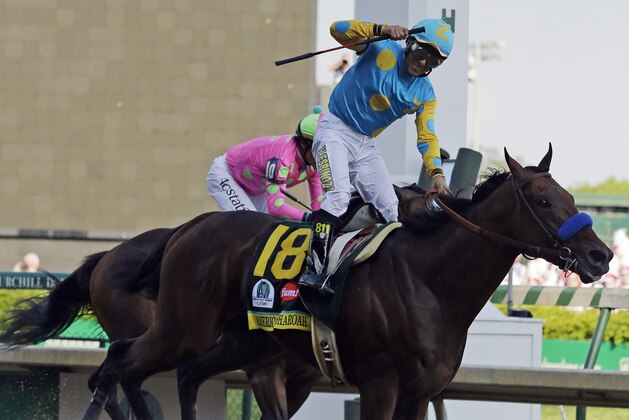 Victor Espinoza rides American Pharoah to victory in the 141st running of the Kentucky Derby horse race at Churchill Downs Saturday, May 2, 2015, in Louisville, Ky. (AP Photo/Brynn Anderson)
