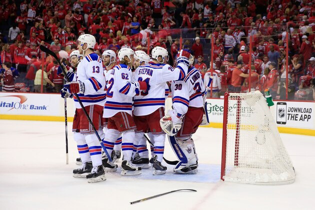 WASHINGTON, DC - MAY 10: Goalie Henrik Lundqvist #30 of the New York Rangers celebrates with teammates following the Rangers 4-3 win over the Washington Capitals during Game Six of the Eastern Conference Semifinals during the 2015 NHL Stanley Cup Playoffs at Verizon Center on May 10, 2015 in Washington, DC.  (Photo by Rob Carr/Getty Images)