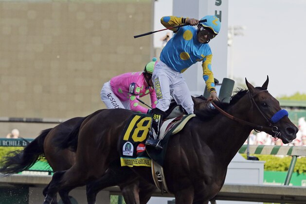 Victor Espinoza rides American Pharoah to victory in the 141st running of the Kentucky Derby horse race at Churchill Downs Saturday, May 2, 2015, in Louisville, Ky. (AP Photo/Brynn Anderson)