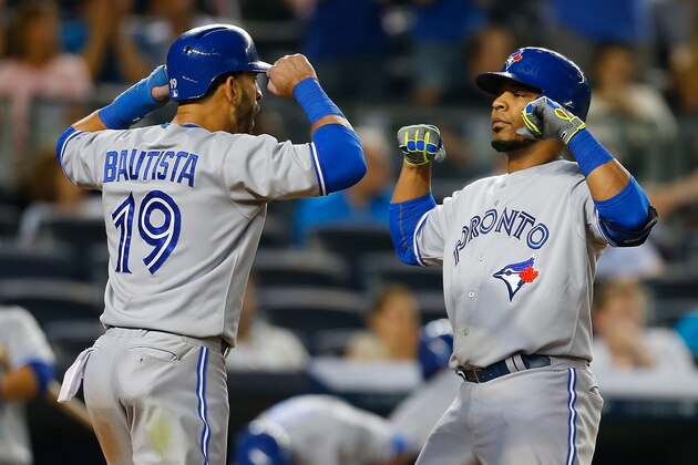 NEW YORK, NY - JUNE 19: Edwin Encarnacion #10 of the Toronto Blue Jays celebrates with Jose Bautista #19 after hitting a two run home run in the eighth inning against the New York Yankees at Yankee Stadium on June 19, 2014 in the Bronx borough of New York City.  (Photo by Mike Stobe/Getty Images)