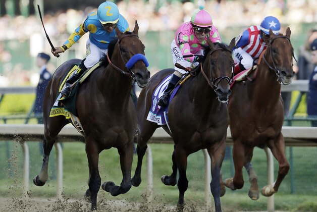 Victor Espinoza rides American Pharoah to victory in the 141st running of the Kentucky Derby horse race at Churchill Downs Saturday, May 2, 2015, in Louisville, Ky. (AP Photo/Jeff Roberson)