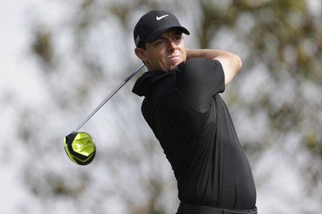 Rory McIlroy watches his tee shot on the 16th hole during the second round of the Wells Fargo Championship golf tournament at Quail Hollow Club in Charlotte, N.C., Friday, May 15, 2015. (AP Photo/Bob Leverone)