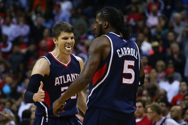 WASHINGTON, DC - MAY 15:  Kyle Korver #26 of the Atlanta Hawks celebrates with DeMarre Carroll #5 during the second half against the Washington Wizards at Verizon Center on May 15, 2015 in Washington, DC. The Hawks defeat the Wizards 94-91.  (Photo by Maddie Meyer/Getty Images)