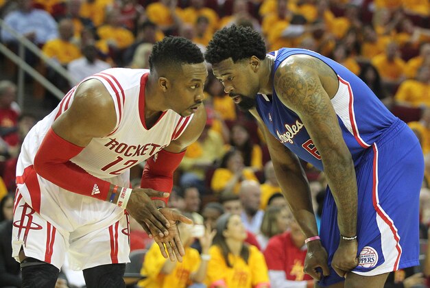 May 12, 2015; Houston, TX, USA; Houston Rockets center Dwight Howard (12) eyes Los Angeles Clippers center DeAndre Jordan (6) in game five of the second round of the NBA Playoffs at Toyota Center. Rockets won 124 to 103. Mandatory Credit: Thomas B. Shea-USA TODAY Sports
