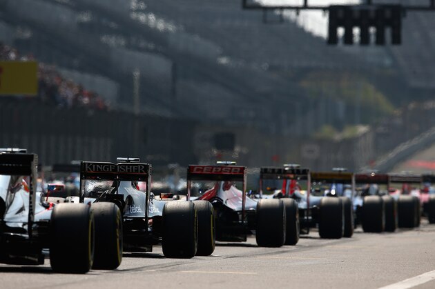 SHANGHAI, CHINA - APRIL 12:  Cars line up on the grid before the Formula One Grand Prix of China at Shanghai International Circuit on April 12, 2015 in Shanghai, China.  (Photo by Clive Mason/Getty Images)