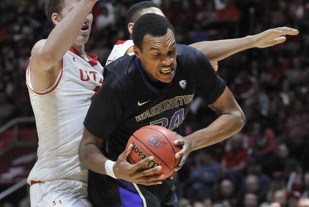 SALT LAKE CITY, UT - JANUARY 25:  Robert Upshaw #24 of the Washington Huskies grabs a rebound against Jakob Poeltl #42 and Jordan Loveridge #21 (blocked from view) of the Utah Utes during the second half at the Jon M. Huntsman Center on January 25, 2015 in Salt Lake City, Utah. Utah won 77-56. (Photo by Gene Sweeney Jr/Getty Images)