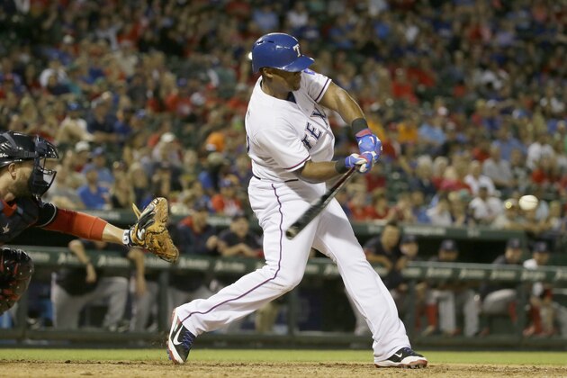 Texas Rangers Adrian Beltre, right, turns on the ball in front of Cleveland Indians catcher Brett Hayes during the seventh inning of a baseball game in Arlington, Texas, Friday, May 15, 2015. (AP Photo/LM Otero)