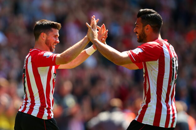 SOUTHAMPTON, ENGLAND - MAY 16:  Shane Long (L) of Southampton celebrates scoring his team's fifth goal with his team mate Graziano Pelle during the Barclays Premier League match between Southampton and Aston Villa at St Mary's Stadium on May 16, 2015 in Southampton, England.  (Photo by Bryn Lennon/Getty Images)