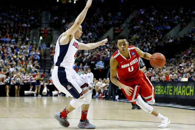 PORTLAND, OR - MARCH 21:  D'Angelo Russell #0 of the Ohio State Buckeyes drives against T.J. McConnell #4 of the Arizona Wildcats in the second half during the third round of the 2015 NCAA Men's Basketball Tournament at Moda Center on March 21, 2015 in Portland, Oregon.  (Photo by Jonathan Ferrey/Getty Images)