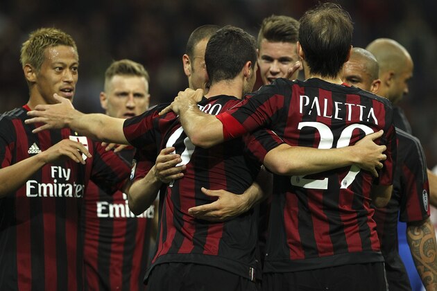 MILAN, ITALY - MAY 09:  Mattia Destro (C) of AC Milan celebrates his goal with his team-mates during the Serie a match between AC Milan and AS Roma at Stadio Giuseppe Meazza on May 9, 2015 in Milan, Italy.  (Photo by Marco Luzzani/Getty Images)