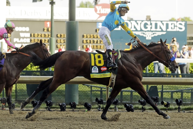 Victor Espinoza rides American Pharoah to victory in the 141st running of the Kentucky Derby horse race at Churchill Downs Saturday, May 2, 2015, in Louisville, Ky. (AP Photo/Morry Gash)