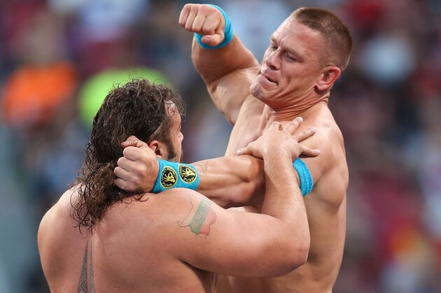 WWE wrestler John Cena punches Rusev at Wrestlemania XXXI, on Sunday, March 29, 2015 in Santa Clara, CA. 2015 marks the first year Wrestlemania will be held in the San Francisco Bay Area, being made available to viewers in 177 countries via the WWE Network. (Don Feria/AP Images for WWE)