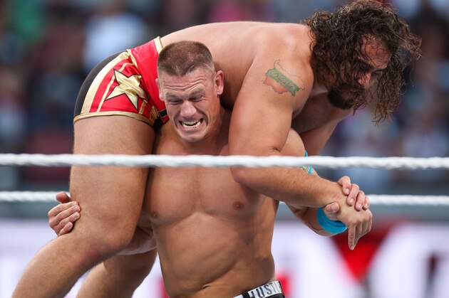 WWE wrestler John Cena carries opponent Rusev at Wrestlemania XXXI, on Sunday, March 29, 2015 in Santa Clara, CA. 2015 marks the first year Wrestlemania will be held in the San Francisco Bay Area, being made available to viewers in 177 countries via the WWE Network. (Don Feria/AP Images for WWE)