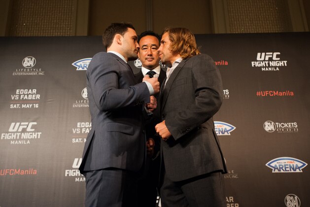 MANILA, PHILIPPINES - MARCH 10:  UFC Asia executive vice president Kenneth Berger stand in the middle of featherweights Frankie Edgar and Uriah Faber during their face off at the UFC Manila Press Conference on March 10, 2015 in Manila, Philippines.  (Photo by Dondi Tawatao/Getty Images)