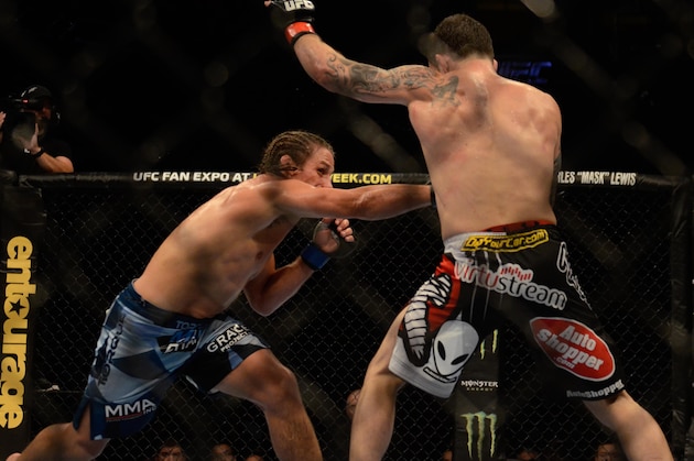 MANILA, PHILIPPINES - MAY 16:  Uriah Faber grapples with Frankie Edgar in their featherweight bout during the UFC Fight Night event at the Mall Of Asia Arena on May 16, 2015 in Manila, Philippines.  (Photo by Dondi Tawatao/Getty Images)
