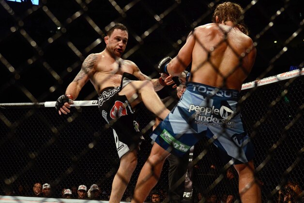 MANILA, PHILIPPINES - MAY 16:  Uriah Faber grapples with Frankie Edgar in their featherweight bout during the UFC Fight Night event at the Mall Of Asia Arena on May 16, 2015 in Manila, Philippines.  (Photo by Dondi Tawatao/Getty Images)