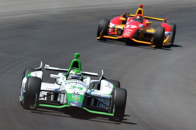 LONG POND, PA - JULY 6 : Carlos Munoz of Colombia, driver of the #34 Cinsay AndrettiTV.com HVM Honda, leads Sebastian Saavedra of Colombia, driver of the #17 AFS KV AFS Racing Chevrolet, during the Pocono INDYCAR 500 at Pocono Raceway on July 6, 2014 in Long Pond, Pennsylvania.  (Photo by Drew Hallowell/Getty Images)