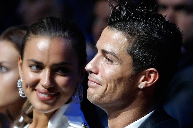 Real Madrid's Portuguese forward Cristiano Ronaldo , right, is seen with his girlfriend, Russian top  model Irina Shayk, during the UEFA Champions League draw in Monaco, Thursday, Aug. 30, 2012. (AP Photo/Claude Paris)