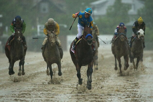 BALTIMORE, MD - MAY 16:  American Pharoah #1 ridden by Victor Espinoza crosses the finish line to win the 140th running of the Preakness Stakes at Pimlico Race Course on May 16, 2015 in Baltimore, Maryland.  (Photo by Patrick Smith/Getty Images)